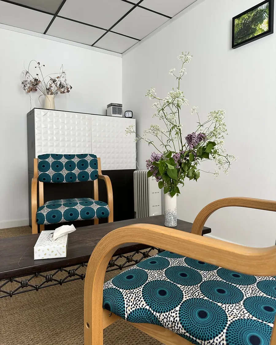 counselling setup in therapy room showing 2 charis either side of a coffee table